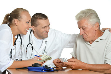 Image showing Old man and doctors