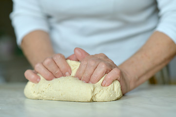 Image showing Woman making dough