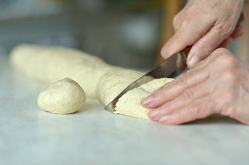 Image showing Woman making dough