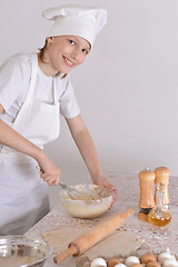 Image showing Boy knead the dough