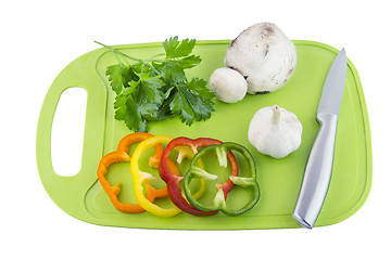 Image showing Parsley and mushroom on green Plastic board