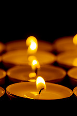 Image showing Tea lights candles with fire