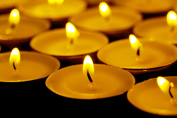 Image showing Tea lights candles with fire