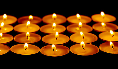 Image showing Tea lights candles with fire