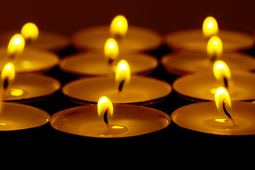 Image showing Tea lights candles with fire