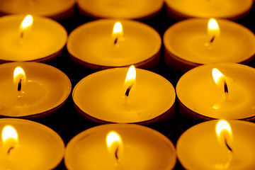 Image showing Tea lights candles with fire