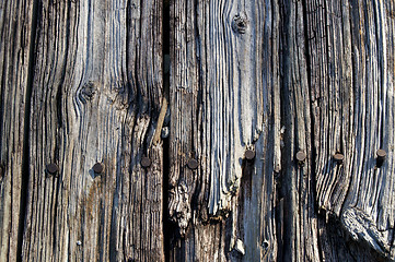 Image showing Old wood rusty nails up close