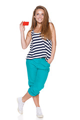 Image showing Positive teen girl smiling showing credit card