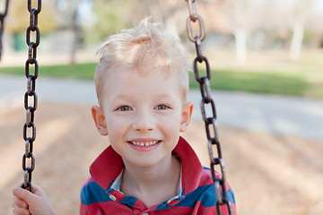 Image showing kid swinging