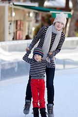 Image showing family ice skating