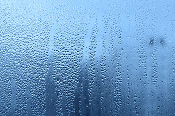 Image showing Natural water drops on glass