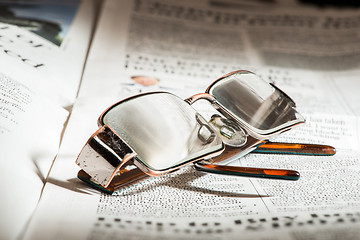 Image showing Glasses on newspaper