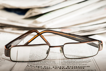 Image showing Glasses on newspaper