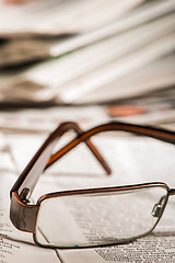 Image showing Glasses on newspaper