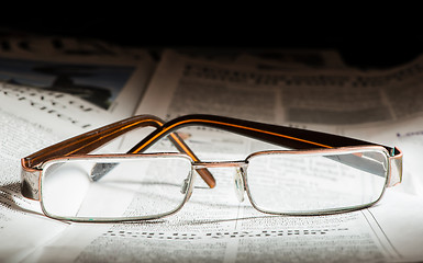 Image showing Glasses on newspaper