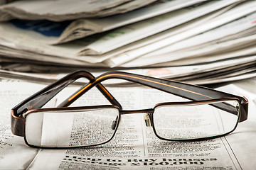 Image showing Glasses on newspaper