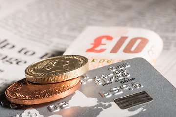 Image showing Coins, credit cards and banknotes on newspaper.