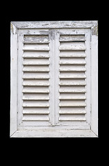 Image showing Old white window with wooden shutters.