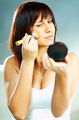 Image showing Girl doing makeup