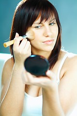 Image showing Girl doing makeup