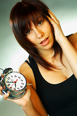 Image showing brunette with clock