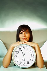 Image showing brunette with clock