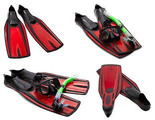 Image showing Set of red flippers, mask, snorkel for diving with water drops