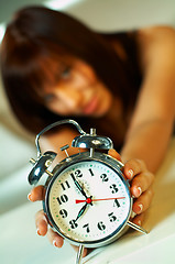 Image showing brunette with clock