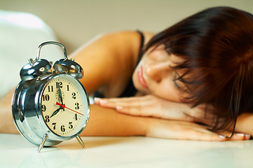 Image showing brunette with clock