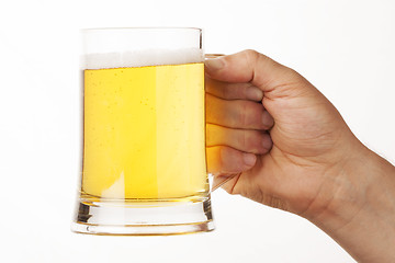 Image showing hand holding glass of beer