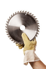 Image showing Circular Saw Blade For Cutting Plastics in hand, safty glove