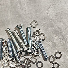 Image showing Screws, nuts, washers on a metal plate