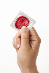 Image showing Hand with condom