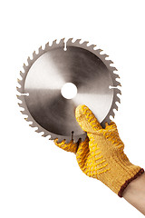 Image showing Circular Saw Blade For Cutting Plastics in hand, safty glove