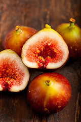 Image showing fresh figs over old wood