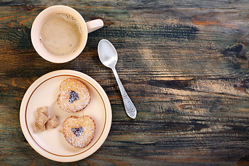 Image showing Coffee and cookies in the shape of heart.