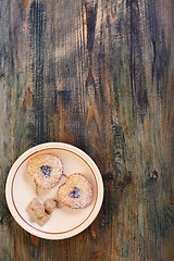 Image showing Linzer Cookie and cane sugar on a saucer.