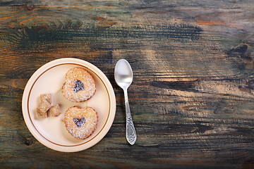 Image showing Teaspoon and saucer with biscuits.