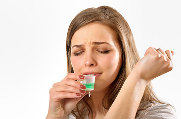 Image showing girl taking cough syrup