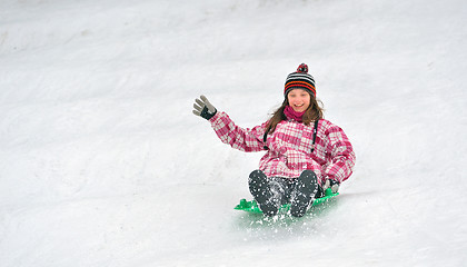 Image showing girl sliding on sled 