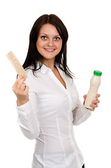 Image showing Beautiful girl with yogurt and crackers 