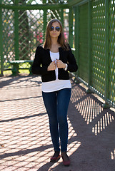 Image showing trendy beautiful girl with sunglasses in a greenhouse