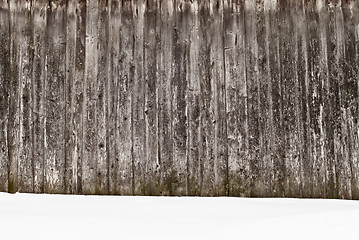 Image showing plank wooden wall in winter, snow on the ground