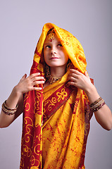 Image showing little girl in traditional Indian clothing and jeweleries