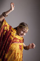 Image showing dancing little girl in traditional Indian clothing and jewelerie