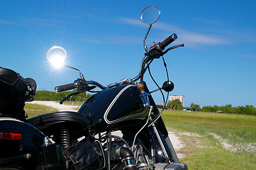 Image showing vintage motorcycle on dirt road
