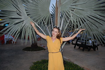 Image showing woman on a background of palms