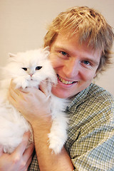 Image showing Man and cat