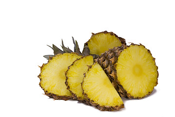 Image showing Pineapple and slices of pineapple on a white background.