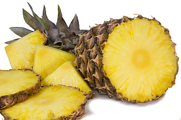 Image showing Pineapple and slices of pineapple on a white background.